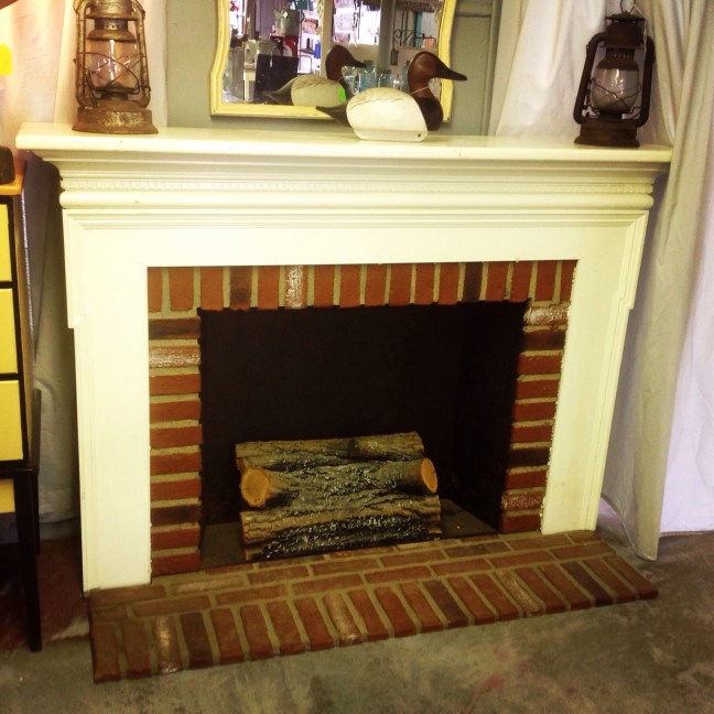 #fireplace#freestanding# wood mantle#brick